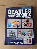 Paperback book titled 'The Beatles Memorabilia Price Guide - 2nd Edition' showing front cover with images of Beatles collectibles and authors' names.