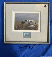 Full view of framed artwork measuring approx 17" x 16" showing snow geese scene and matting