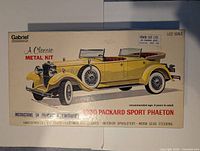 Top view of the kit box showing box art with yellow 1930 Packard Sport Phaeton convertible car illustration, branding by Gabriel and Irwin Toy Ltd, and text detailing kit features and scale.