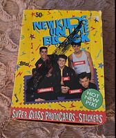 Close up of one pack front showing New Kids on the Block members and colorful 1989 Topps branding on bright yellow background.