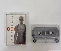 Photo of MC Hammer cassette tape and its plastic case showing the front artwork and cassette details.