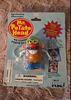 Front of original Mr. Potato Head keychain blister pack with figure attached and branding.