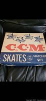 Photo of original boxed CCM ice skates showing vintage box with logo and star graphics