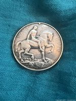 Reverse side with horseman design and year inscriptions