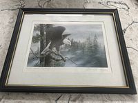 Framed print showing eagle in natural forest setting, artist signature and title visible