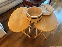 Overview of the two wooden folding TV tables with the popcorn bowl and ceramic bowls on top.