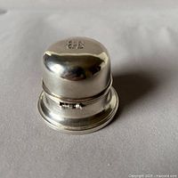 Top view of polished sterling silver ring presentation box with visible BIRKS hallmark on flat lid.