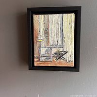 Frontal photo of the original oil painting showing the living room interior scene with chair, lamp, table, and curtains in yellow tones within a black frame.