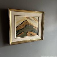 Framed modernist oil painting hung on wall, showing full artwork and frame.