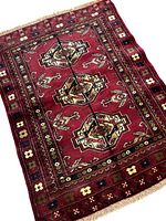 Full view of the Turkmen Bokhara handmade rug showing central medallion pattern and floral border