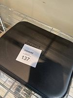 Closed black hard carrying case showing AEE branding for the Sparrow drone.