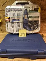 Alltrade rotary tool kit in transparent hard plastic case with multiple attachments and accessories visible