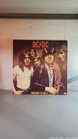 Front cover of the ACDC Highway to Hell vinyl record showing band members and album title.