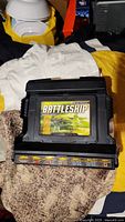 Electronic Battleship game cartridge on black game base