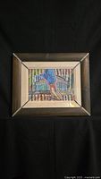 Framed mixed media original artwork showing person's legs and feet with colorful cityscape background.