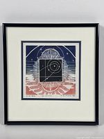 Framed woodcut print showing entire artwork with double mat and black frame