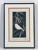 Framed print of bird and bamboo with artist signature visible.