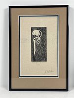 Full view of the framed woodcut print showing the entire artwork and frame.