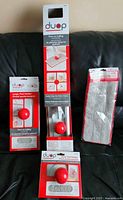 Photo of Duop mop combo set package with mop handle, quick ball attach, and microfiber pads in sealed packaging