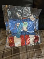 Packaged new boys size 8 Captain America onesie with visible red, white, and blue superhero uniform print.