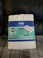 Sealy Signature white twin sheet set in original packaging, brand new and sealed.