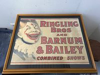 Full front view of framed poster leaning against wall