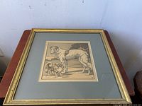 Full view straight on of framed dog print showing Borzoi and Pekinese dogs in muted brown/beige tones.