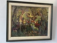 Framed print showing a dense garden scene with flowers and plants, visible mat and frame, photographed from multiple angles to show condition and details.