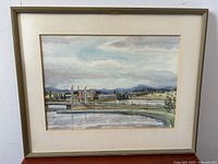 Frontal photo of the framed watercolor landscape showing the entire painting and frame.