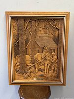 Full view of the pressed wood wall art showing a rustic maple syrup scene with cabin, horse, man, and dog.