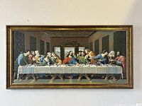 Frontal view of the framed Last Supper paint by numbers oil painting hung on a wall