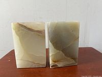 Two solid polished marble rectangular bookends facing front surface, 6 inches tall, showing natural marble veining