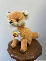 Front view of the Steiff Cosy Fuzzy Fox with visible tags and detailed facial features.