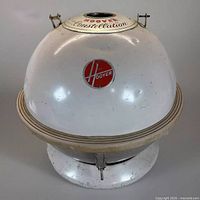 Front view of the spherical body of the Hoover Model 84 Constellation vacuum cleaner showing the iconic Hoover emblem and product details.