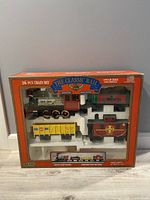 Front view of boxed Classic Rail Echo 26 piece train set showing locomotives and cars in styrofoam insert