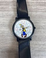 Front view of vintage Lorus quartz wristwatch with colorful Goofy dial and black leather strap