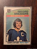 Front of the 1976-77 Darryl Sittler Record Breakers hockey card showing the player's image in Toronto Maple Leafs uniform with Most Points, Game record title.