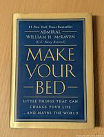 Front cover of 'Make Your Bed' book by Admiral William H. McRaven showing title and subtitle.