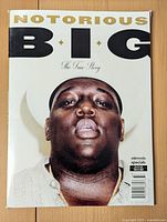 Front cover of the first magazine featuring a close-up image of Notorious B.I.G. with white background.
