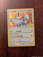 Front view of Lugia Holo Pokemon Celebrations card showing artwork, stats, and Pikachu 5th anniversary logo.