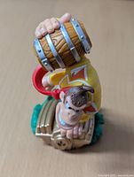 Top view of Donkey Kong figure holding barrel, standing on treasure chest base.