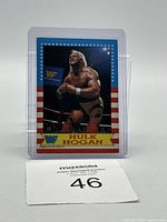 Front view of 1987 O-Pee-Chee WWF Hulk Hogan #3 trading card showing image of Hulk Hogan in wrestling ring with red, white and blue star border and WWF logo.