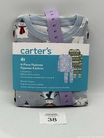 Folded Carter's 4T size four-piece pajama set with light blue background and snowman pattern labeled with a purple 4T tag.