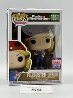 Front view of Funko Pop box showing Filibuster Leslie figure with red ladybug hat and overalls. Includes 2021 Summer Limited Edition sticker.