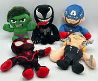 Five Marvel small plush figures including Hulk, Venom, Captain America, Thor, Miles Morales displayed together.