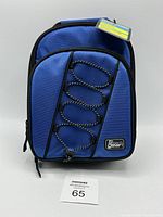 Front view of the blue Tech Gear insulated lunch bag showing front elastic bungee cord, zipper, handle, and brand patch.