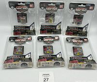Six unopened Transformers Action Micro Figures arranged in two rows of three, sealed in original blister packaging with colorful Transformers graphics.