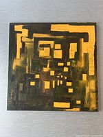 Full view of the square canvas abstract oil painting showing dominant yellow and dark green geometric shapes outlined in black.