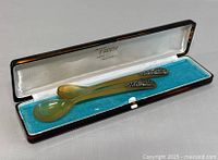 Set of fork and spoon displayed inside the original hinged box lined with blue velvet and white fabric inscribed with brand name 'Fanny' and location Majorca.