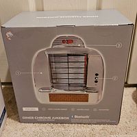 Box showing the retro chrome surface and control panel of the diner chrome jukebox wireless speaker.